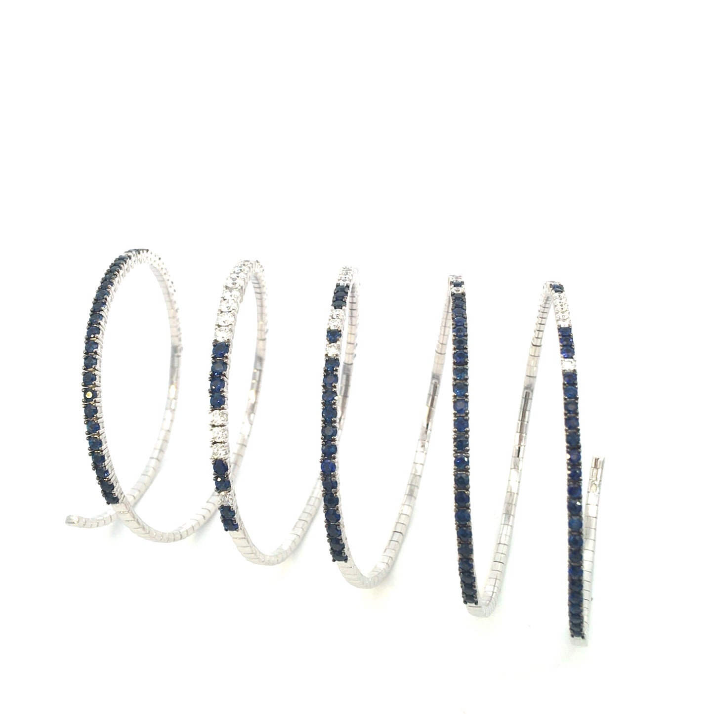 White gold spiral bracelet with diamond and blue sapphire spring