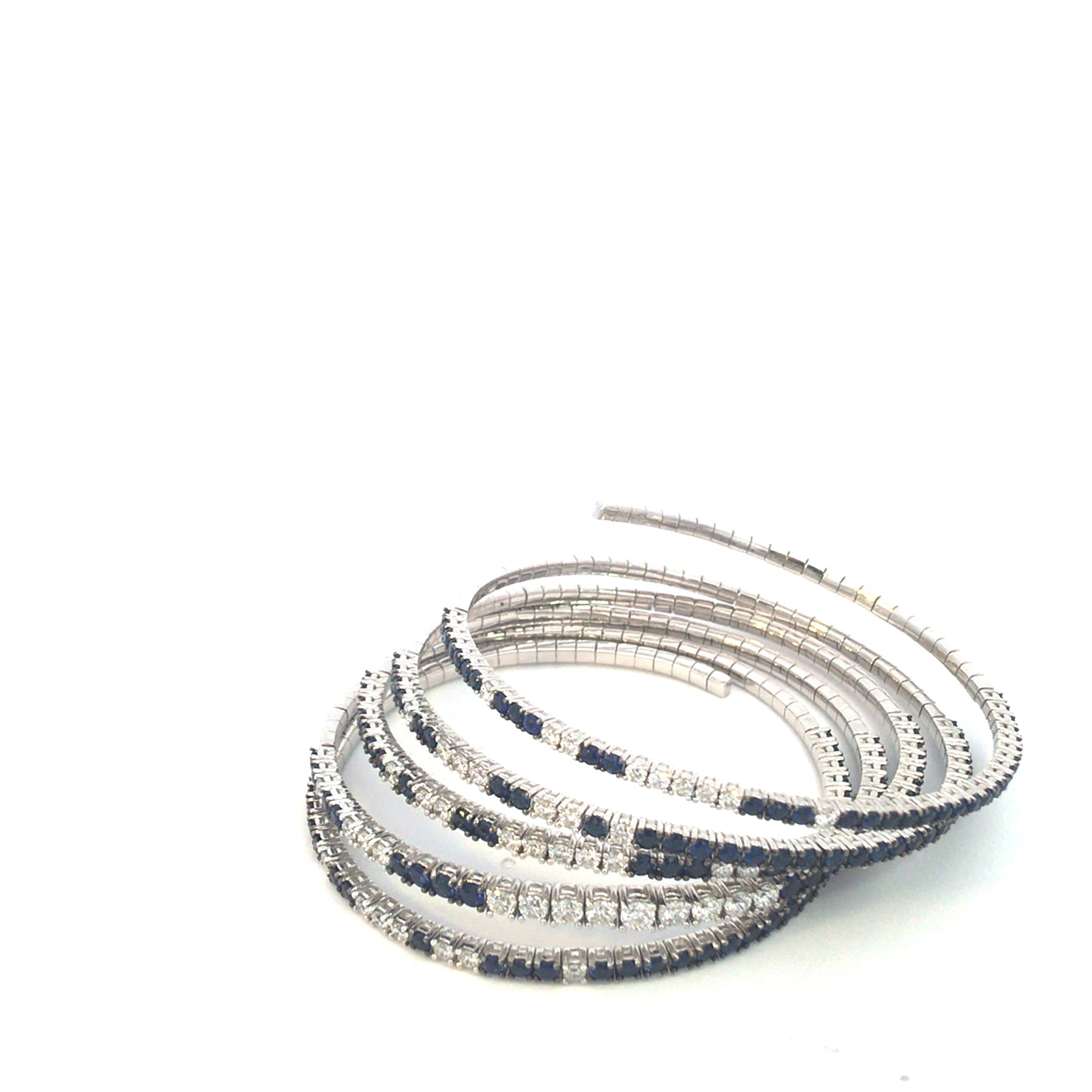 White gold spiral bracelet with diamond and blue sapphire spring
